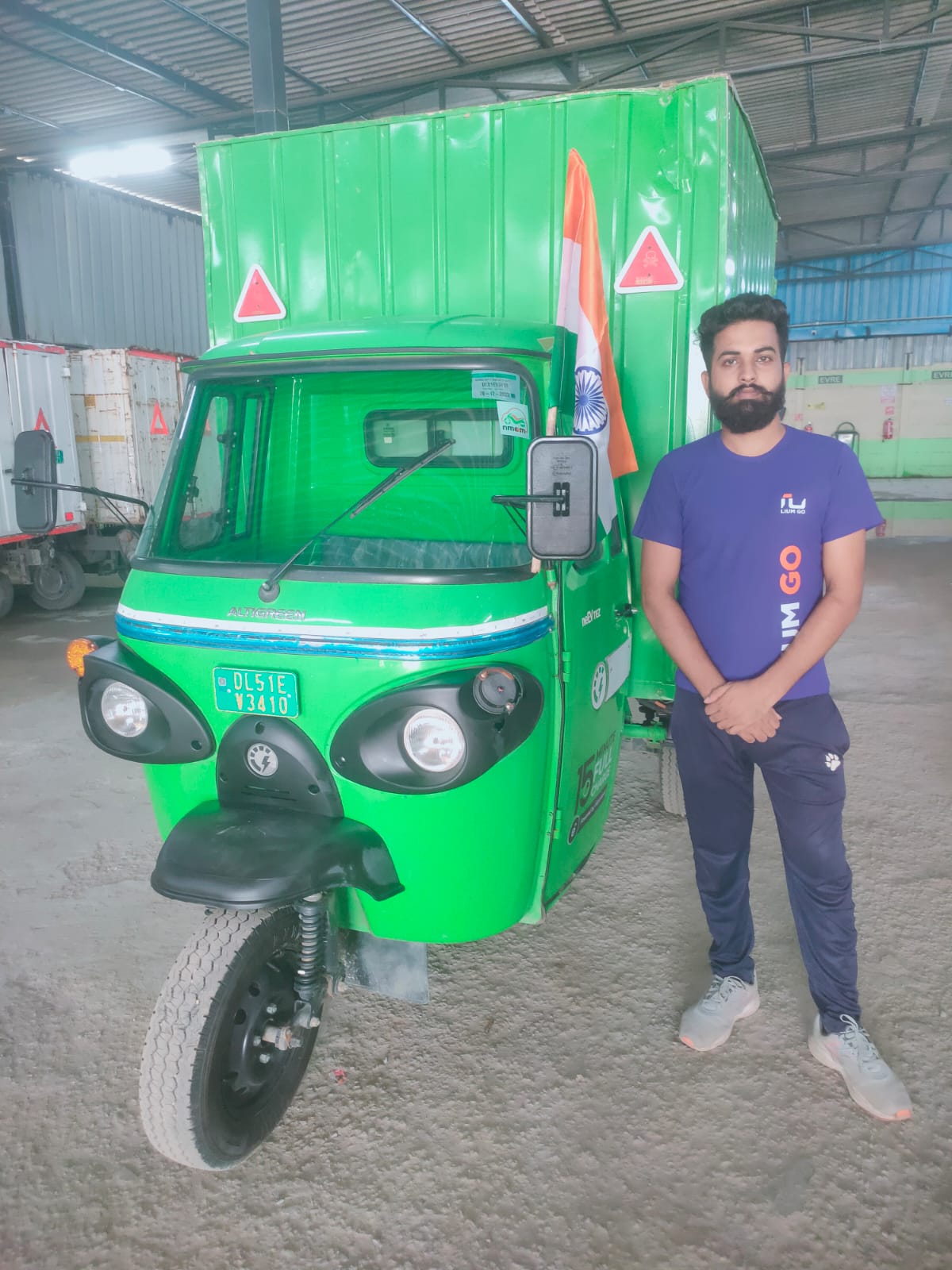 Lium Go EV vehicle and rider at a warehouse
